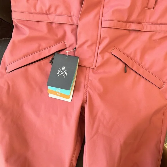 Snowverb one piece snow suit never used.